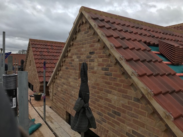 New red roof tiles and scaffolding DH Roofing Contractors, Norfolk